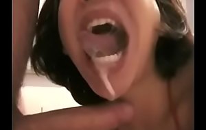 Asian girl gives a spot on target blowjob