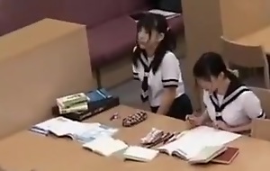 Asian schoolgirl cum-hole teased in the bookwork on camera