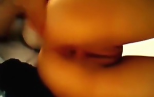 Elfin dark haired asian camgirl fingers her wet bald pussy closeup on her bed